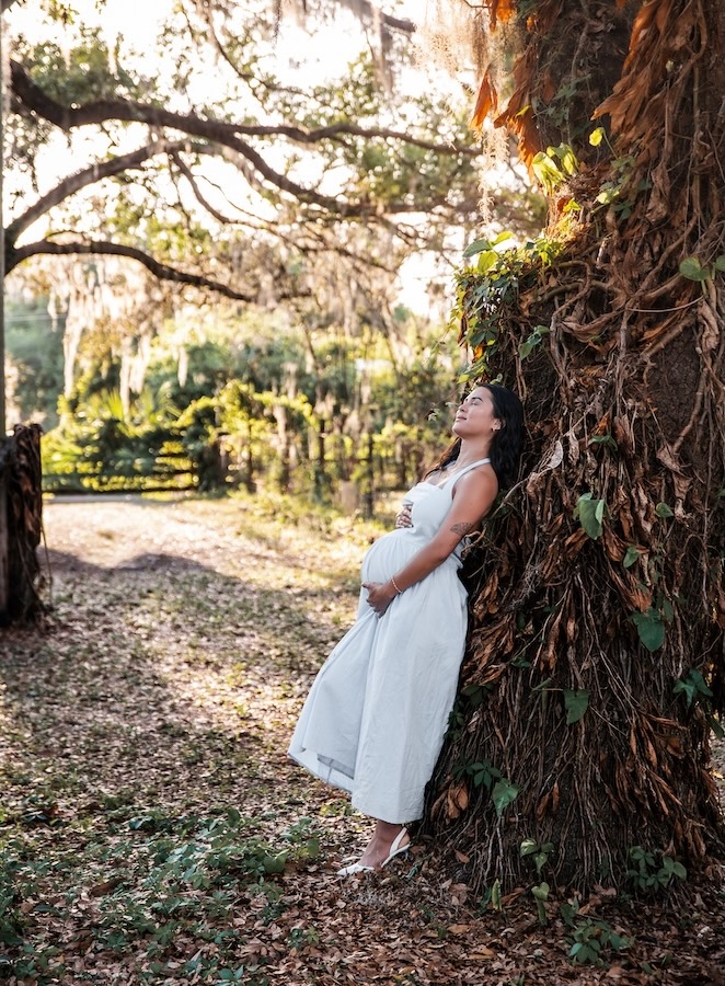 A maternity shoot taken at a greenhouse in Tampa, Florida