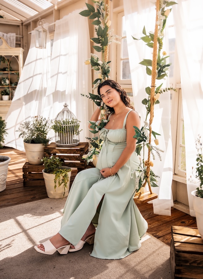 A maternity shoot taken at a greenhouse in Tampa, Florida