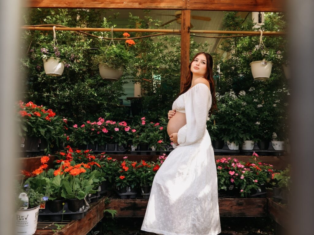 A maternity shoot taken at a flower shot in Tampa, Florida
